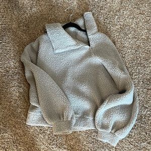 Express crop fleece sweatshirt with asymmetrical zipper